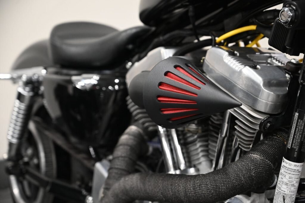 Detailed view of a custom motorcycle engine and air filter cone in Toronto.